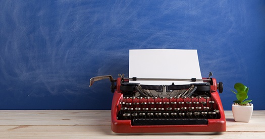 typewriter with blue background