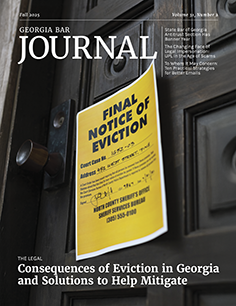 Close up of an exterior door painted black with a yellow eviction notice showing.